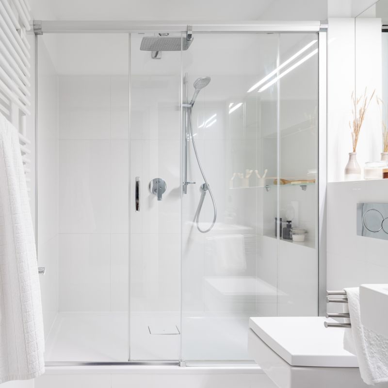 Glass Shower Walls with Metal Accents